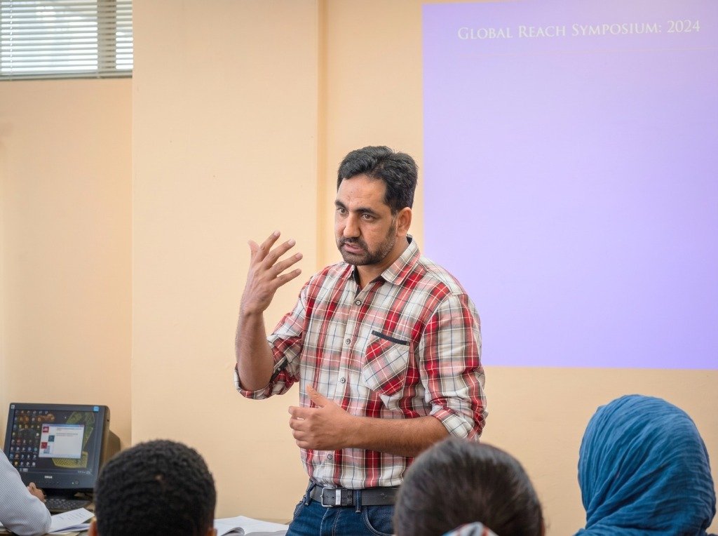 Dr. Muhammad Shakil Ahmad presenting at Global Reach Symposium